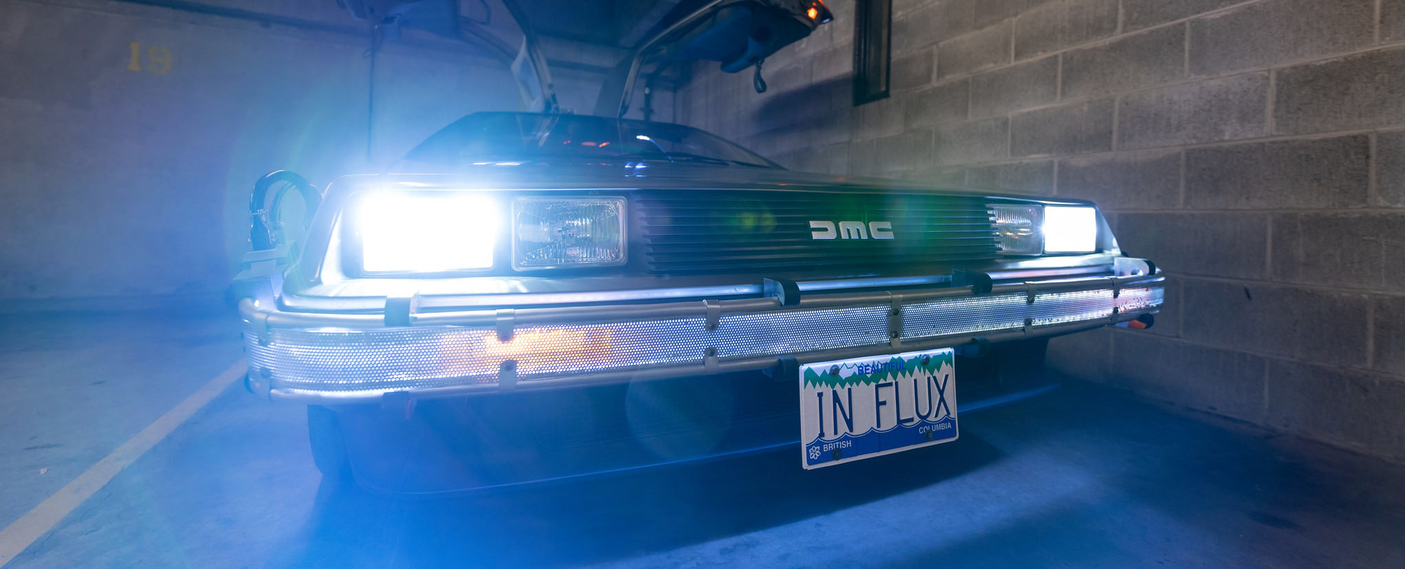 DeLorean 'Time Machine' replica, with license plate: 'IN FLUX'